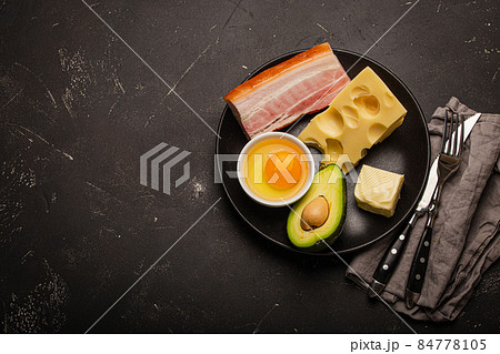 Foods for keto diet on black plate on dark background copy space Foods for keto diet on black plate on dark background copy space 84778105