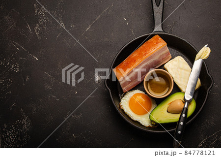 Foods for keto diet in cast iron pan on dark background copy space Foods for keto diet in cast iron pan on dark background copy space 84778121