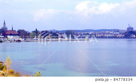 LINDAU, GERMANY - 14 OCT 2015: Lindau harbour promenade on Lake Constance LINDAU, GERMANY - 14 OCT 2015: Lindau harbour promenade on Lake Constance 84778334