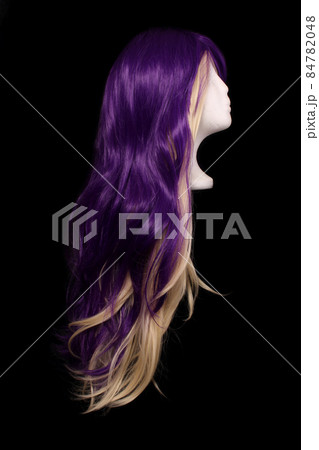 Purple and Blond Wig on Black Background Purple and Blond Wig on Black Background 84782048