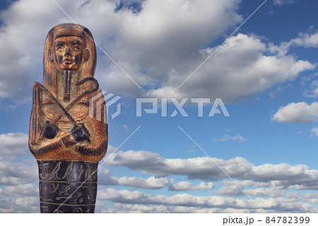Egyptian Pharaoh Statue with Hieroglyphics and Blue Sky Egyptian Pharaoh Statue with Hieroglyphics and Blue Sky 84782399