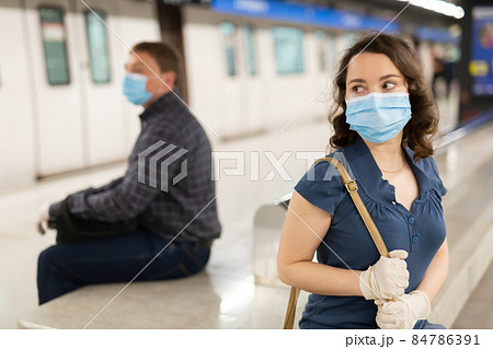 Woman in personal protective equipment at metro station Woman in personal protective equipment at metro station 84786391