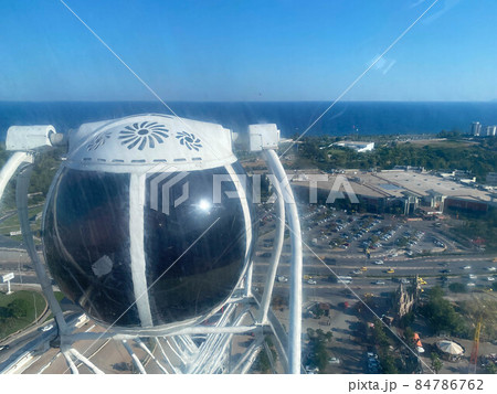 Ferris Wheel in Helsinki. Finland. Rest in an amusement park. Cabins ferris wheels. Amusement park. Entertainment in the city of Helsinki. Ferris wheel bottom view. Attractions close up 84786762