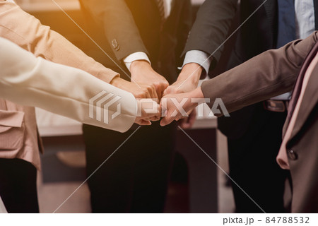 Group of business people putting their fists success for dealing,Team work to achieve goals,Hand coordination Group of business people putting their fists success for dealing,Team work to achieve goals,Hand coordination 84788532