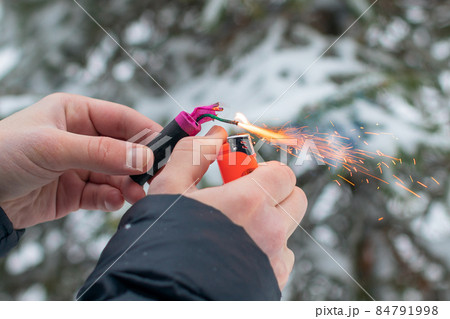 Guy Sets Fire to the Flash Noise Firecracker Outdoors 84791998