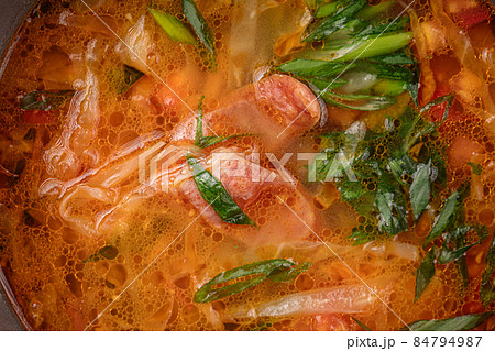 Closeup on rustic chicken noodle soup with eggs Closeup on rustic chicken noodle soup with eggs 84794987