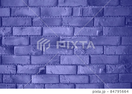 the color of 2022 is very peri. brick wall is a great background for design 84795664