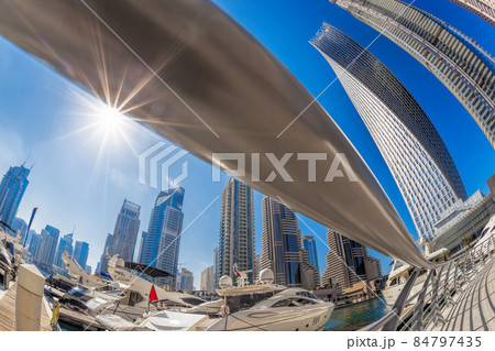 Dubai Marina with luxury boats against skyscrapers in Dubai, United Arab Emirates Dubai Marina with luxury boats against skyscrapers in Dubai, United Arab Emirates 84797435