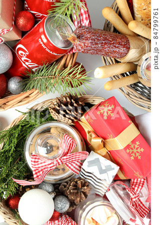 Odessa, Ukraine - November 10, 2021: Concept of gift with Christmas basket, close up Odessa, Ukraine - November 10, 2021: Concept of gift with Christmas basket, close up 84799761