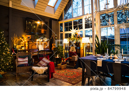 interior in vintage style with retro furniture, piano and garlands in evening.  84799948
