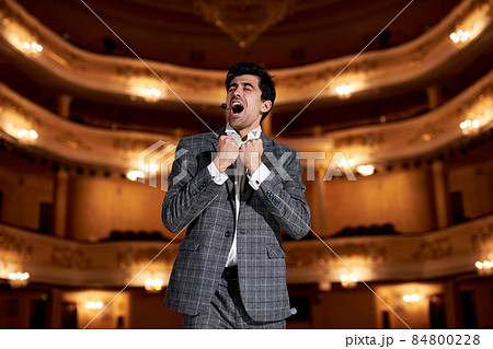 Theatre play a young actor in original image. Professional performance concept Theatre play a young actor in original image. Professional performance concept 84800228
