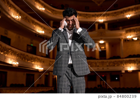 Handsome Guy Is Trying To Mind Something Standing On Stage During Performance Handsome Guy Is Trying To Mind Something Standing On Stage During Performance 84800239