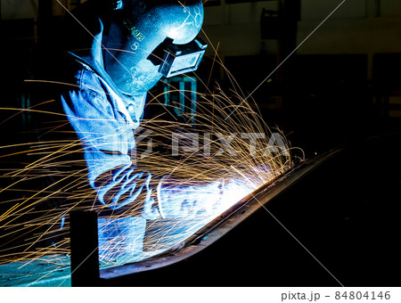 Industrial Worker at the factory welding Industrial Worker at the factory welding 84804146