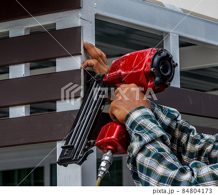 Pneumatic nails gun shooting 84804173