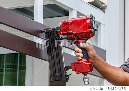 Pneumatic nails gun shooting 84804176