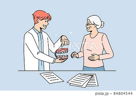 Male doctor consult old patient about teeth prosthesis Male doctor consult old patient about teeth prosthesis 84804544