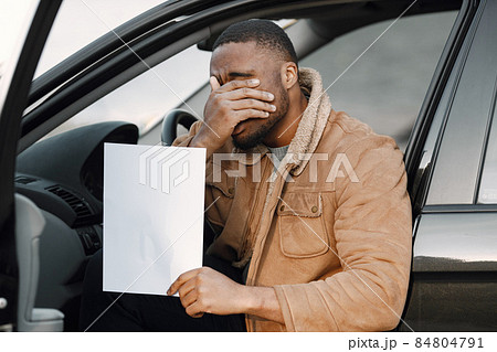 Black man with impression of embarrassment on his face Black man with impression of embarrassment on his face 84804791