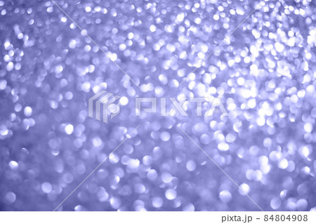 Brilliant background color of the year 2022 with silver Christmas texture, abstract light of sparkling stars on the side. High quality photo 84804908