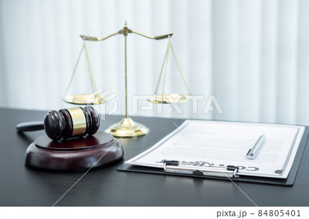 Judge gavel with Justice at law firm in background with legal case document contract, law and justice, attorney, lawsuit 84805401