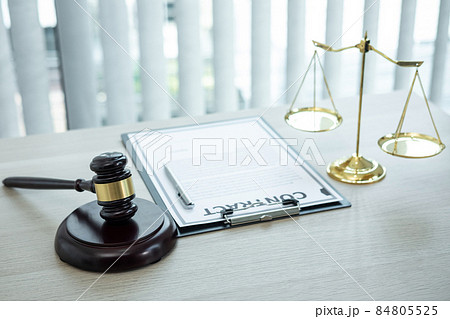 Judge gavel with Justice at law firm in background with legal case document contract, law and justice, attorney, lawsuit Judge gavel with Justice at law firm in background with legal case document contract, law and justice, attorney, lawsuit 84805525