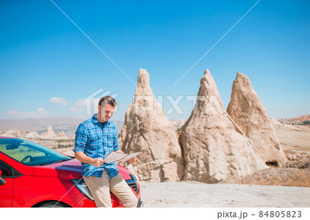 Happy man on summer vacation in famous place. Cave formations. 84805823