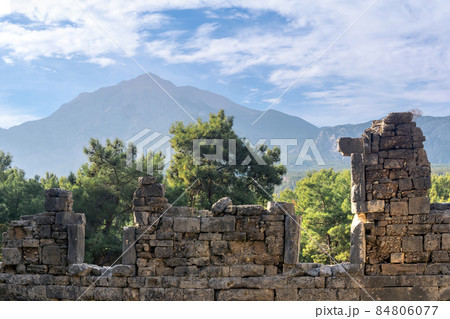 ruins of antique building in the ancient city of Phaselis, Turkey, against the backdrop of Mount Tahtali (Lycian Olympus) ruins of antique building in the ancient city of Phaselis, Turkey, against the backdrop of Mount Tahtali (Lycian Olympus) 84806077