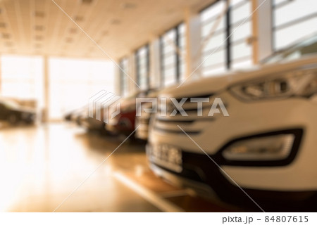 New cars at sunlit dealer showroom close view 84807615