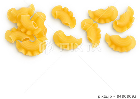 Pasta cornetti creste macaroni isolated on white background with clipping path. Top view with copy space for your text. Flat lay Pasta cornetti creste macaroni isolated on white background with clipping path. Top view with copy space for your text. Flat lay 84808092