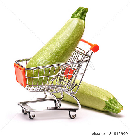 Studio shot of zucchini marrow in shopping cart isolated on white background Studio shot of zucchini marrow in shopping cart isolated on white background 84815990