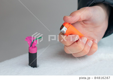 Guy Sets Fire to the Flash Noise Firecracker Outdoors 84816287