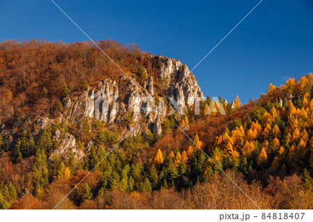 Mountainous landscape with rocks and forests in autumn. Mountainous landscape with rocks and forests in autumn. 84818407