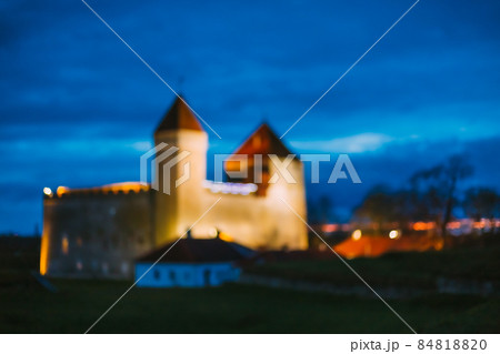 Kuressaare, Saaremaa Island, Estonia. Episcopal Castle In Evening Blue Hour Night. Traditional Medieval Architecture, Famous Attraction Landmark. Old Tower. bokeh, blurred background Kuressaare, Saaremaa Island, Estonia. Episcopal Castle In Evening Blue Hour Night. Traditional Medieval Architecture, Famous Attraction Landmark. Old Tower. bokeh, blurred background 84818820