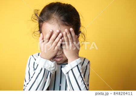a upset child girl looking down  84820411