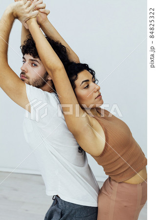 Man and woman together doing exercises family yoga asana fitness Man and woman together doing exercises family yoga asana fitness 84825322
