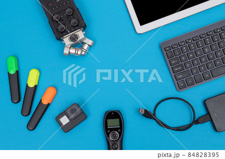 Workplace With Digital Gadgets on Blue Table Workplace With Digital Gadgets on Blue Table 84828395
