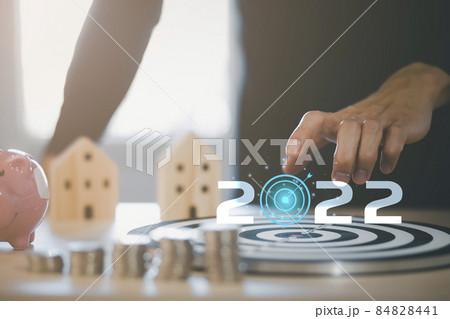 2022 new year and Targeting the new business concept, Businessman use fingers touch dart to virtual target dart board,Executive marketing, investment goal and target for business investment. 2022 new year and Targeting the new business concept, Businessman use fingers touch dart to virtual target dart board,Executive marketing, investment goal and target for business investment. 84828441