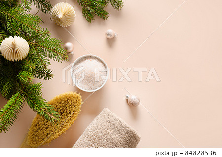 Relax and wellness before Christmas holiday. Cosmetic sea salt, wellness objects. 84828536