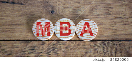 Concept word MBA on circles on a beautiful wooden table. 84829006