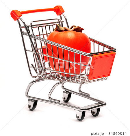 Studio shot of ripe persimmon in shopping basket isolated on white background Studio shot of ripe persimmon in shopping basket isolated on white background 84840314