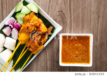 Malaysian chicken satay with delicious peanut sauce. Malaysian chicken satay with delicious peanut sauce. 84841493