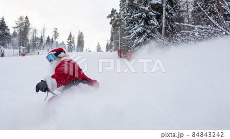 Santa Claus skiing downhill 84843242