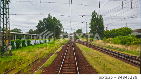Point of view train travel under cloudy sky 84845239