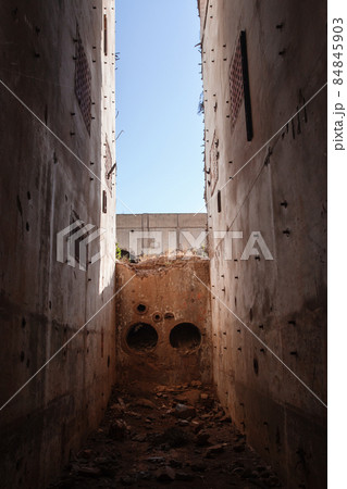 Empty grungy concrete interior. Walls of abandoned power plant 84845903