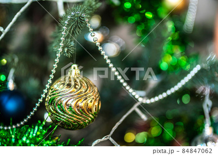 Merry x-mas,Close up of Colorful balls ,gifts box and Christmas greeting picture parcel decoration on Green Christmas tree background Decoration During Christmas and New Year. 84847062