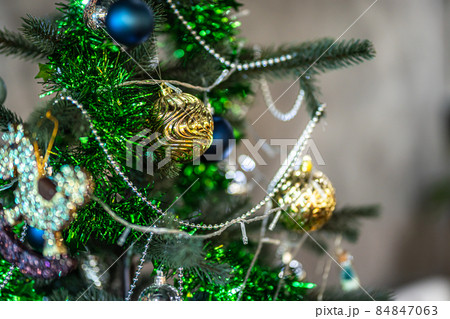 Merry x-mas,Close up of Colorful balls ,gifts box and Christmas greeting picture parcel decoration on Green Christmas tree background Decoration During Christmas and New Year. Merry x-mas,Close up of Colorful balls ,gifts box and Christmas greeting picture parcel decoration on Green Christmas tree background Decoration During Christmas and New Year. 84847063
