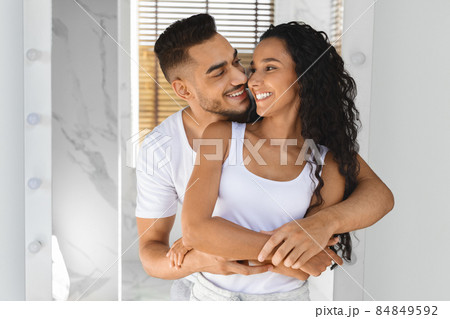 Portrait Of Young Happy Arab Spouses Embracing In Bathroom Interior Portrait Of Young Happy Arab Spouses Embracing In Bathroom Interior 84849592
