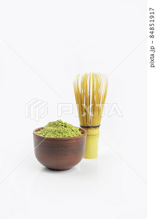 dry powder green tea japanese with bamboo whisk on white background 84851917