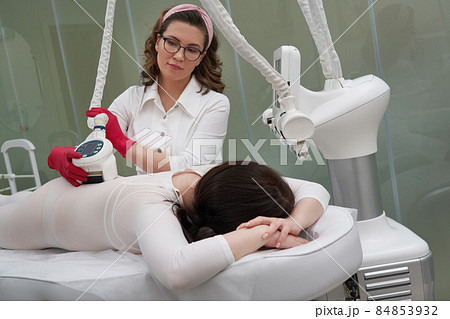 Beautiful woman getting beauty cellulite therapy Beautiful woman getting beauty cellulite therapy 84853932