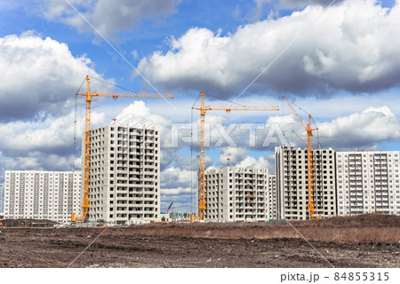 Lifting crane at a construction site Lifting crane at a construction site 84855315