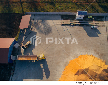 Aerial View Over The Grain Warehouse. Truck Unloads Corn Grain. 84855608